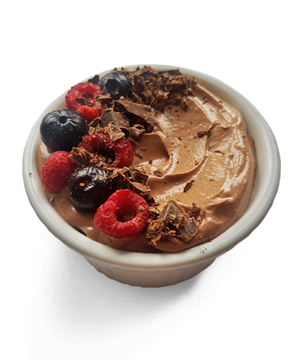 nz protein mousse in a bowl with berries