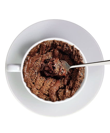 nz protein mug cake in a white bowl with spoon