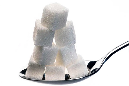 sugar cubes on a spoon stock image