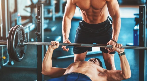 men bench pressing stock image