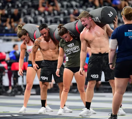 men and women competing in crossfit stock image