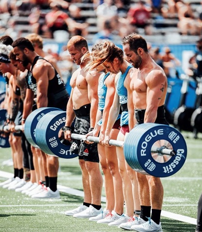 men and women at crossfit games stock image