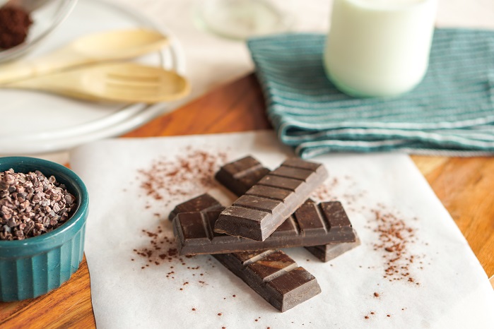 protein chocolate bars piled on table 