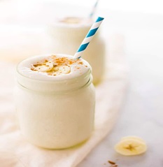 protein shake in glass jar and straw
