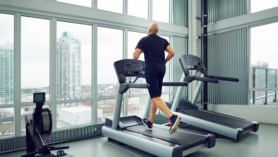 man running on a treadmill stock image