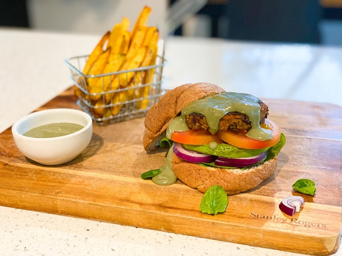 keto burger with super blend sauce on cutting board