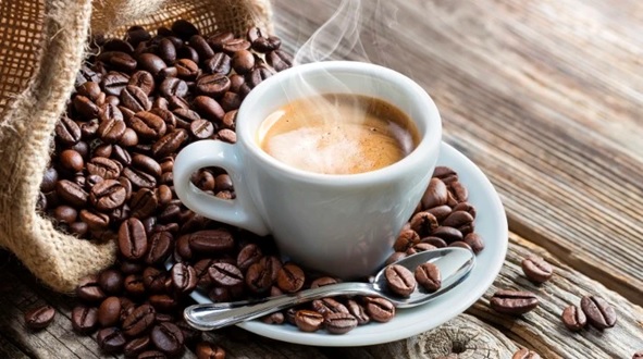 cup of coffee and coffee beans stock image