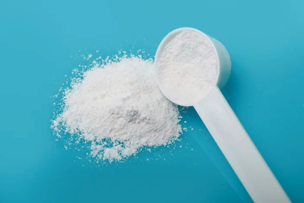 caffeine powder and white scoop stock image
