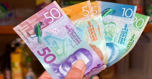 handful of New Zealand cash stock image