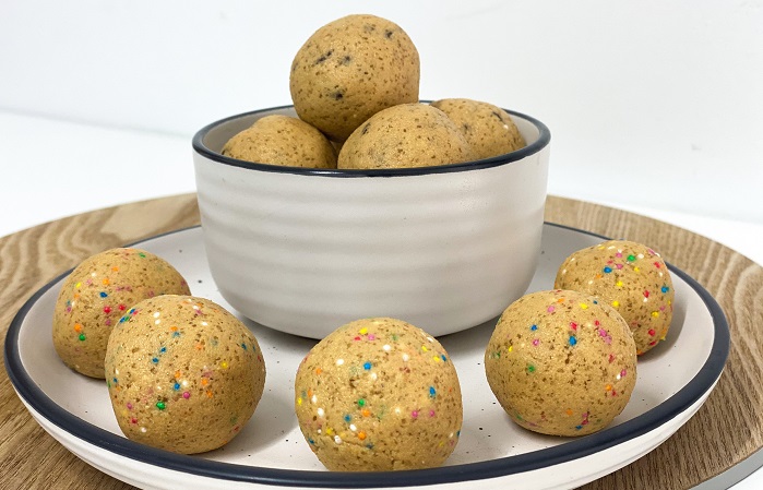 pea protein cookie dough balls with choc chips and sprinkles