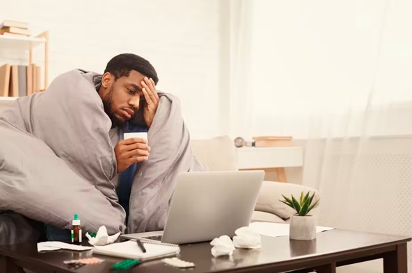 man with flu resting stock image