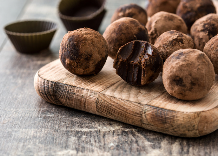 green banana protein balls chocolate variation on a cutting board