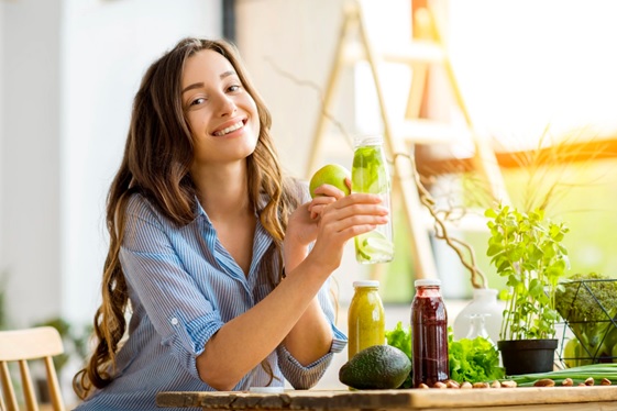 woman in the sun with vegetables and long hair stock image