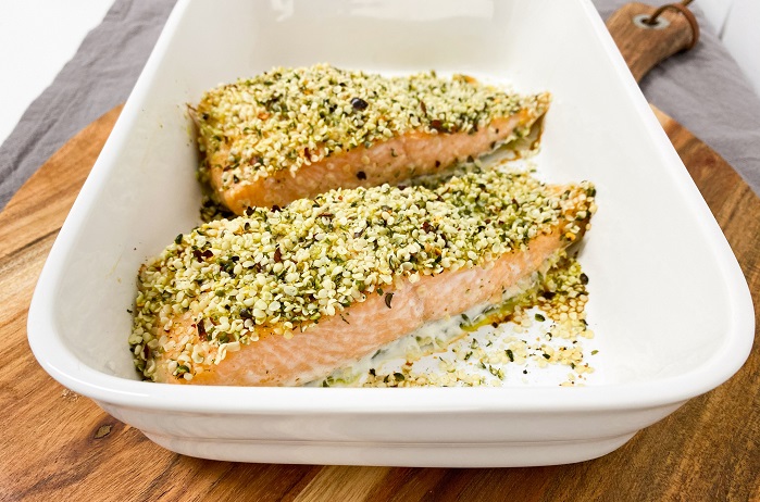 hemp seed crusted salmon fillet in white dish