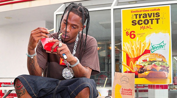 man outside eating takeaway food stock image