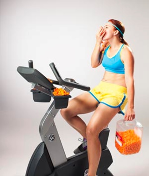 woman on treadmill yawning stock image