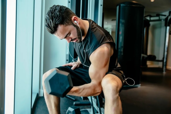 man curling a dumbell stock image