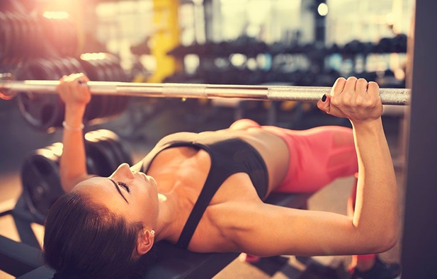 women using bench press stock image