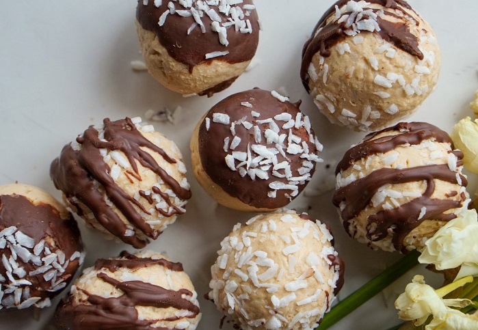 chocolate coconut protein balls drizzled with chocolate
