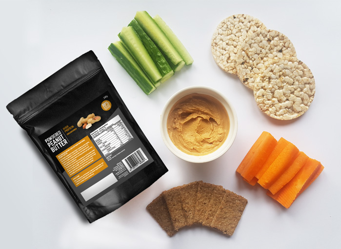 powdered peanut butter bag with cucumber, crackers, carrots, rice crackers