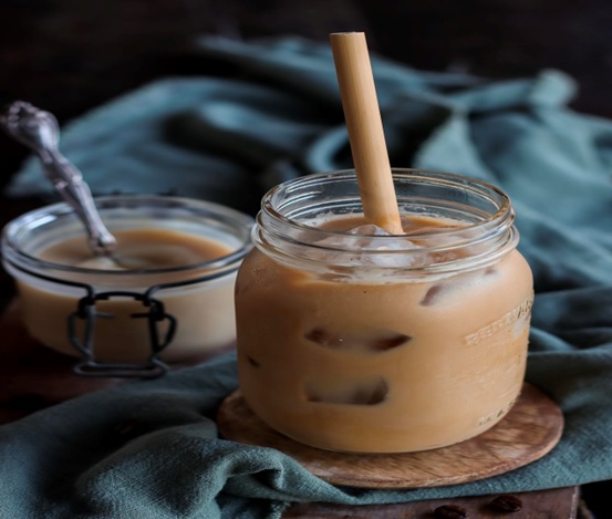 jars of coffee with ice and straws stock image