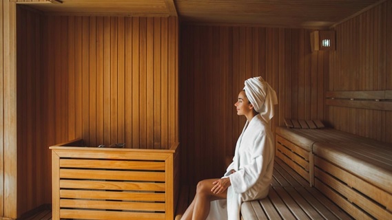 woman relaxing in sauna stock image