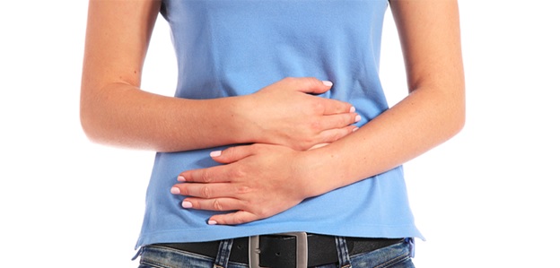 woman clutching her stomach stock image