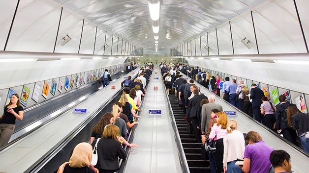 people taking the subway elevator stock image