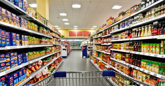 trolley in a supermarket aisle stock image