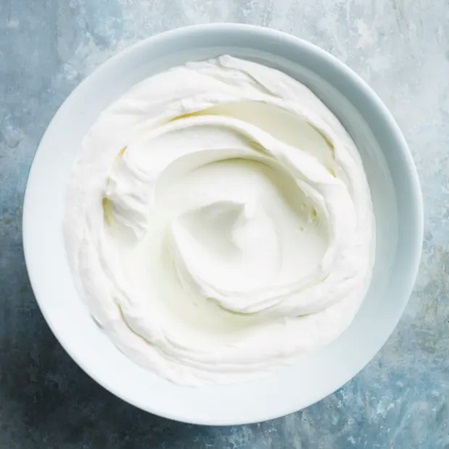 yoghurt in a bowl stock image